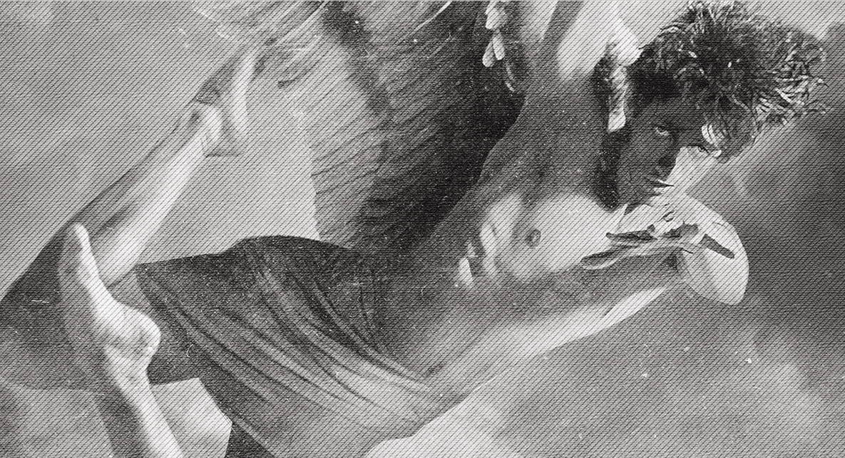 A shirtless man with tousled hair and an intense expression performs a dynamic martial arts kick in mid-air, with one leg extended and arms positioned for balance. The image has a dramatic, high-contrast, artistic effect.